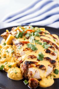 Zesty Mexican Chicken with Creamy Cheddar Cheese Sauce Recipe